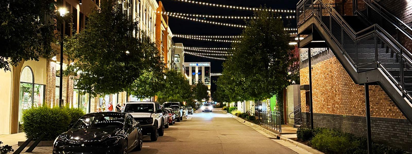 Shops and string lights at Fenton in Cary, NC at night